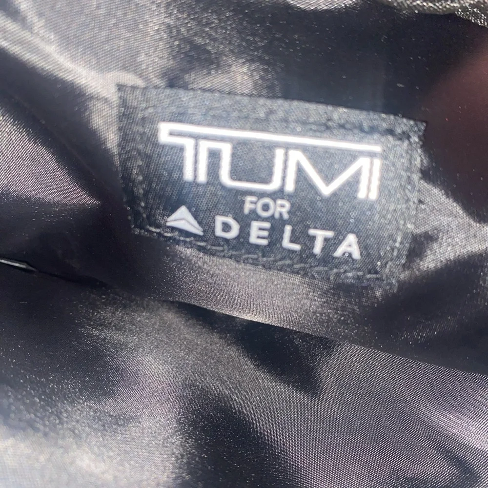 Tumi for delta travel purple bag